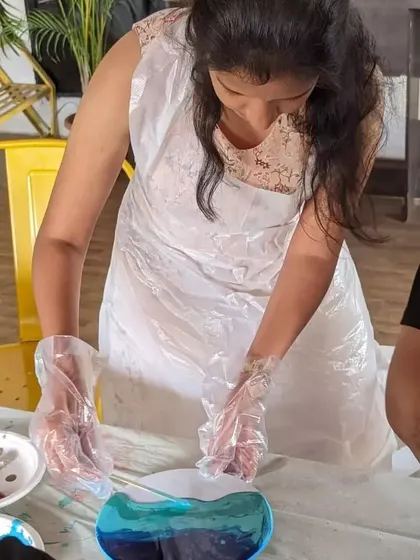 A participant focused on her resin art project. The process is meditative and allows for a great digital detox.