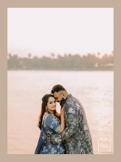 A serene couple portrait taken during their Sangeet event, with the soft light of sunset creating a beautiful, romantic glow.