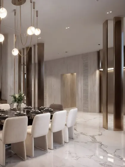 A dining area in a Dubai residence, where bronze pillars and a cascading globe chandelier create a sense of modern opulence.