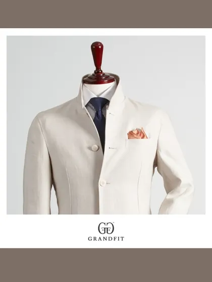 A detailed view of the mandarin collar and precise button placement on our custom Bandhgala. Every element is meticulously considered to achieve a clean and polished finish in our tailored menswear.