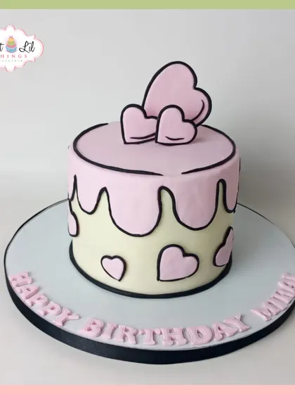 A cute and trendy cartoon-style cake. This minimalist pink and white heart-themed cake looks like it's straight out of a comic book.