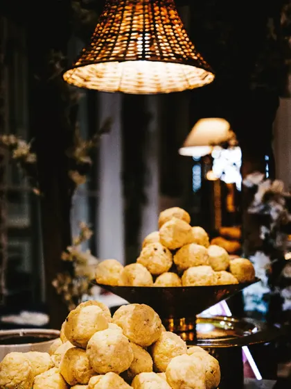 A mountain of soft, fluffy Dahi Bhallas waiting to be drenched in sweet yogurt and tangy chutneys. This is a classic dish that I prepare with the utmost care to ensure it's perfectly soft and delicious.