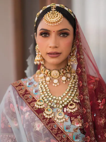 A direct look that captures the intensity of the maroon halo eye makeup. It’s a bold choice that paid off beautifully.