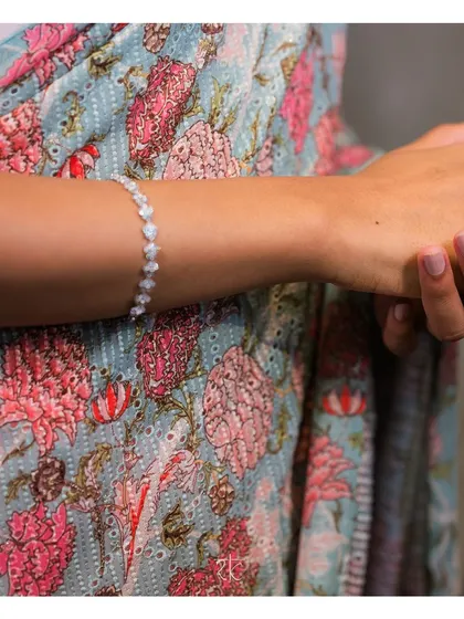 A detail shot of the printed georgette fabric, showcasing its delicate floral pattern and soft color palette.