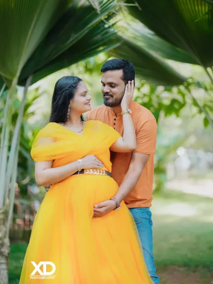An intimate close-up of a couple in a garden, showing their loving connection.