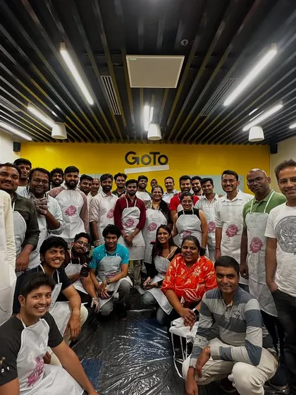 The whole team from GoTo Technologies after their successful and messy fluid art session. Look at those smiles and amazing creations.
