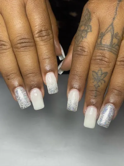 A popular choice for modern brides, these square-shaped extensions feature a milky white base with a holographic glitter gradient. I teach you how to achieve this soft yet sparkling look.