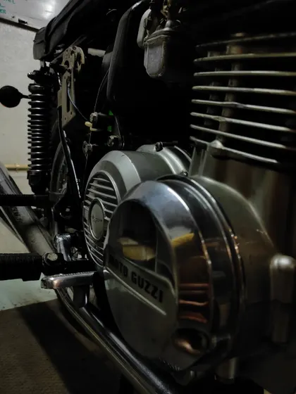 A close-up of the unique V-twin engine configuration of the Moto Guzzi 350 GTS.