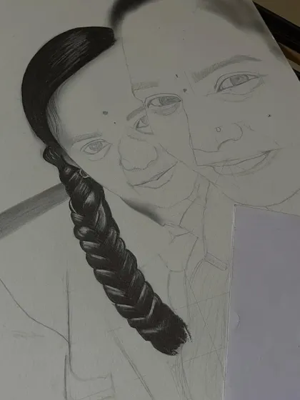 A work-in-progress shot of a realistic portrait, focusing on the detailed work of the hair and face.