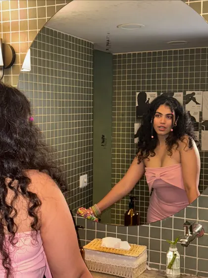 A mirror selfie from my birthday trip. This pink dress is simple but the color makes a statement. It's a great example of how a single bold color can be just as impactful as a print.