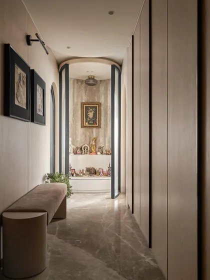 With its doors open, the Mandir at the end of the master suite entrance is revealed. The use of fluted glass doors provides privacy while creating a beautiful, serene focal point.