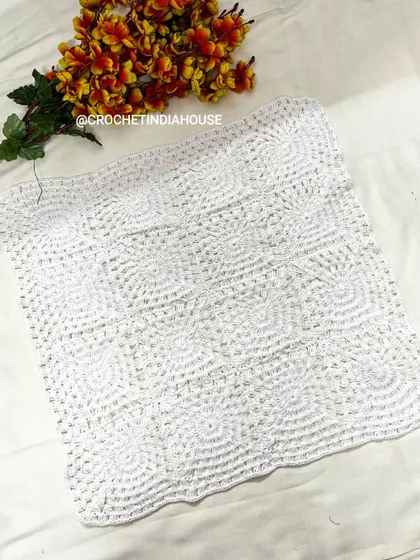 Another look at the square crochet table mat, highlighting the detailed stitch work. All my pieces are washable and made to last.