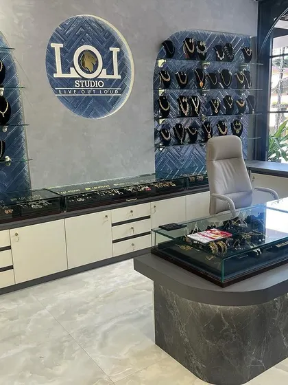 The layout of our studio is designed for a seamless customer experience, from browsing the wall displays to sitting down for a personalized custom design session at the main counter.