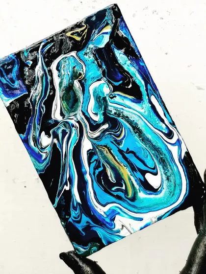 A beautiful abstract piece created during a fluid art session. The way the colors blend and create new forms is always a surprise.