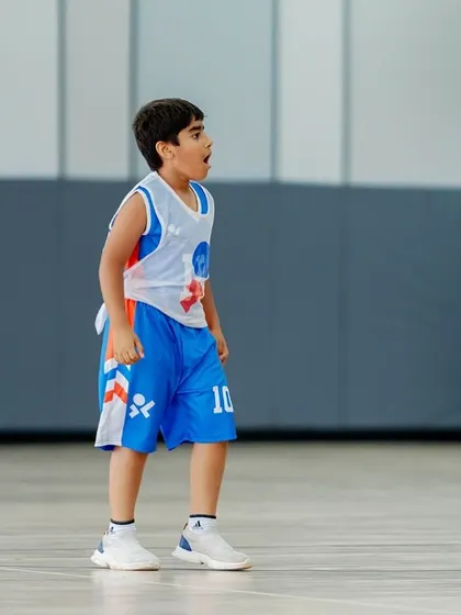 The look of surprise and fun on a young player's face during a game.