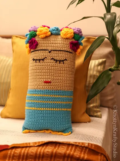 A close-up of the Frida cushion, showing the detailed embroidery of her face and the colourful flowers in her hair. Each stitch is a tribute to her spirit.