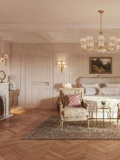 This view highlights the bedroom's classic fireplace and ornate mirror. These elements, combined with the detailed wall paneling and gilded furniture, create a sophisticated and romantic atmosphere reminiscent of a Parisian apartment.