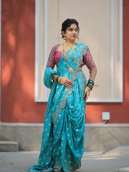 Another beautiful pose from the Gudi Padwa series, highlighting the intricate details of the saree and the classic Maharashtrian styling.