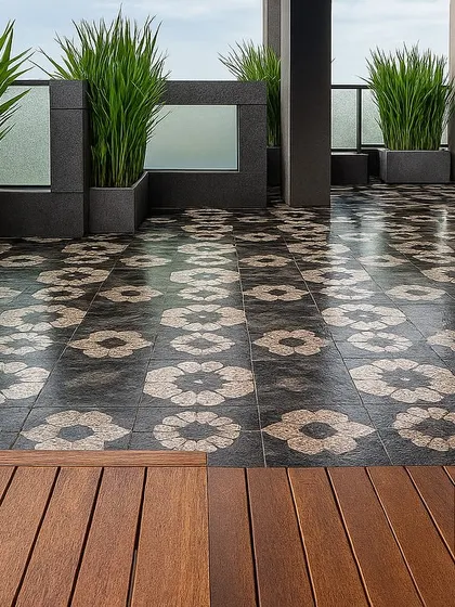 This view from the wooden deck shows the striking floral-patterned tiles that cover the main terrace area, adding a bold decorative element to the landscape design.