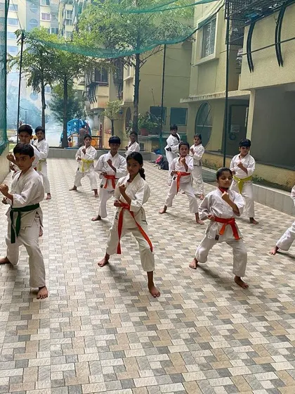 Students at our Purva Belmont dojo practice their basic stances and punches in an outdoor session. Strong Kihon is the key to progress in both Kata and Kumite.