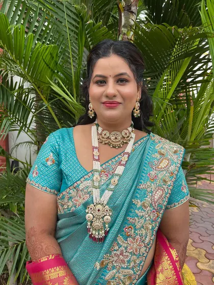 A portrait showing the stunning traditional jewellery paired with a soft glam makeup look.