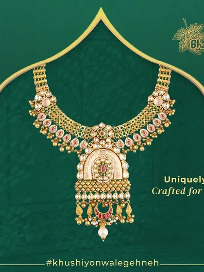A unique creation where vintage Chandan work meets modern Kundan and pearls. This heavy bridal necklace features a grand pendant with a classic Chandbali motif, designed to be a uniquely crafted centerpiece for your wedding day.