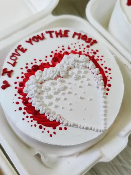 A sweet "I love you the most" bento cake with a textured heart design. Perfect for anniversaries or just because.