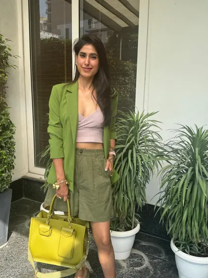 The secret to this outfit's aesthetic is analogous color harmony. By selecting colors that sit side-by-side on the color wheel, like the greens and yellows here, you create a look that feels cohesive, balanced, and pleasing to the eye.