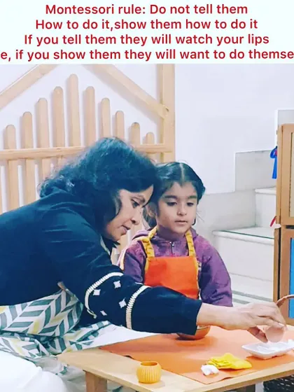 Our guiding principle is "Show them, don't tell them." In our prepared environment, a teacher gently demonstrates a practical life activity, allowing the child to observe and learn through action, not just words. This fosters deep concentration and a love for learning.