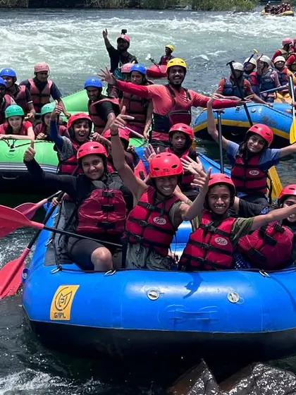 A flotilla of happy rafters celebrating on the Kali River in Dandeli. Our courses often bring large groups together, creating a vibrant and energetic atmosphere on the water.