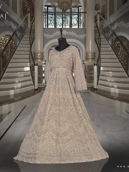 Another view of the light beige tail gown, a true statement piece that radiates grace and royalty.