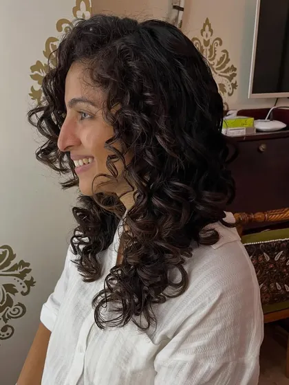 Aishwarya enjoying the movement and shape of her new curly cut.