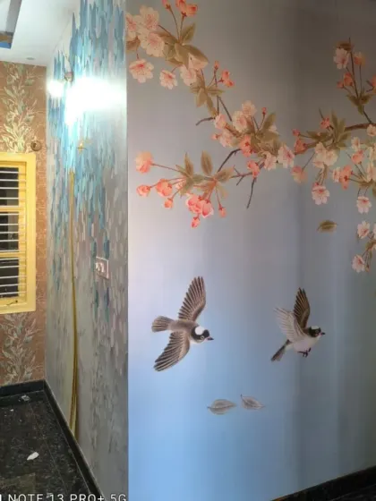 A custom mural combining two different styles: a textured pattern and a beautiful cherry blossom branch with birds.