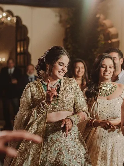 The bride and her friends caught in a happy moment on the dance floor. It's all about candid fun!