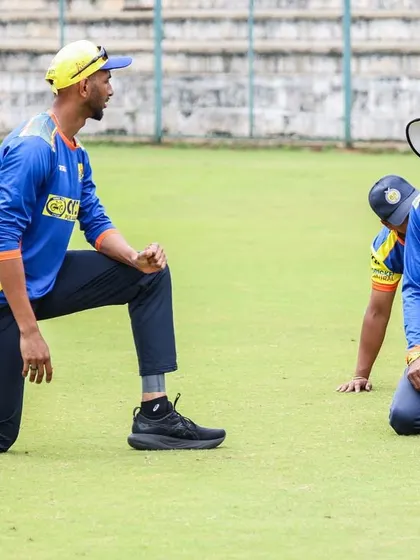 On the ground, observing and talking with players. Coaching is about being present and engaged in their journey.