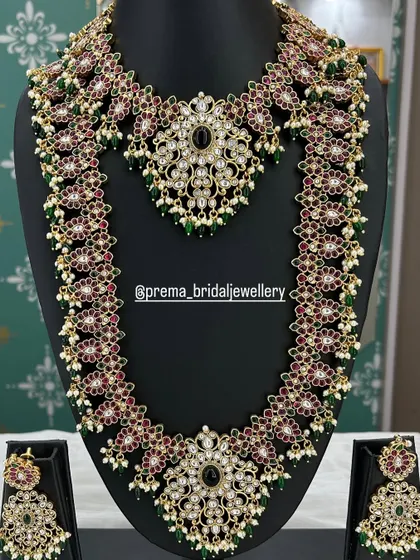 A beautiful Kundan-style set with a mix of red, green, and black stones.