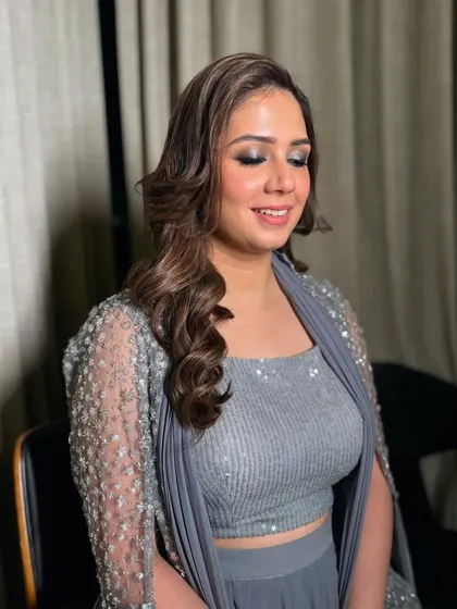 A smiling shot of the smokey eye look. It's glamorous but still soft, letting her happy expression shine.