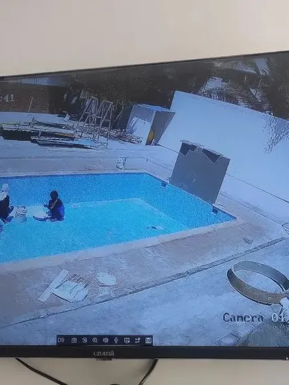 I also handle poolside and garden camera setups. This view shows a swimming pool area under surveillance, ensuring safety and security.
