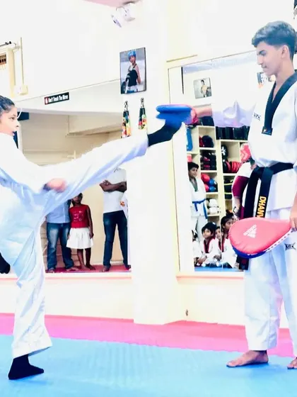 This student shows great form and extension in her kick during a drill.
