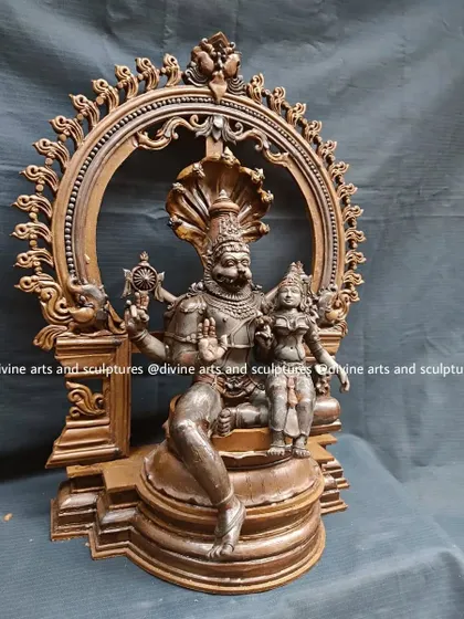 Another perspective of the Lakshmi Narasimha wax model, detailing the interaction between the two deities and the intricate carving on the throne and archway.