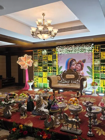 An angled view of the Krishna-themed naming ceremony stage.