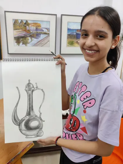 The finished pencil sketch of a metal jug. This piece demonstrates a strong understanding of form, reflection, and texture, all essential components of a strong art portfolio.