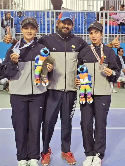 Our coach Suraj Bikkannavar with two medal winners from the Karnataka team at the 38th National Games. His leadership contributes to success at the state level.