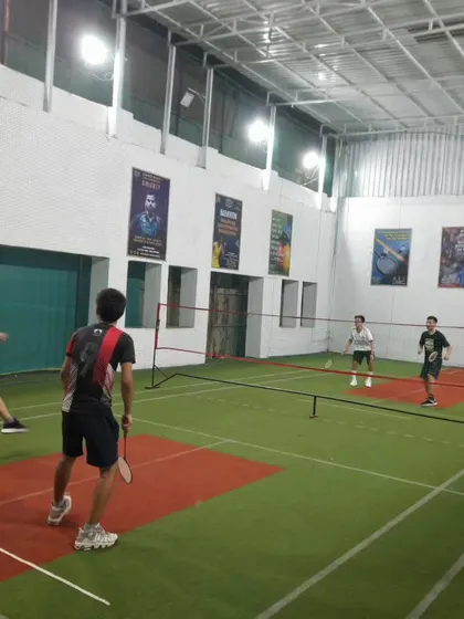 A player mid-air, about to connect with a powerful smash. This is the kind of action we love to see.