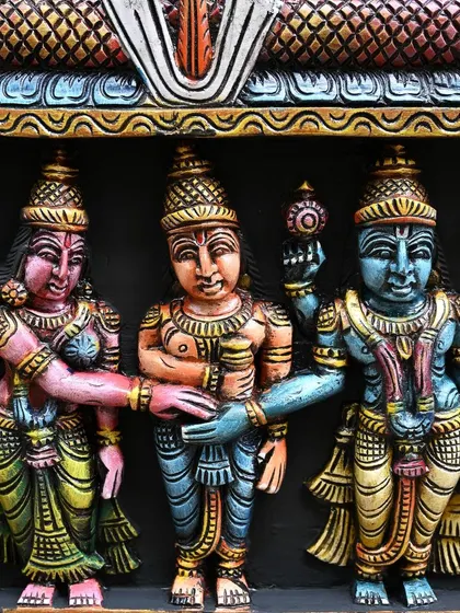 The central moment of the Meenakshi Thirukalyanam, where Lord Vishnu gives away his sister Meenakshi to Lord Shiva, is captured in this vibrant detail.