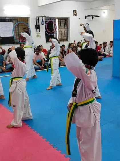 An instructor demonstrates a block.