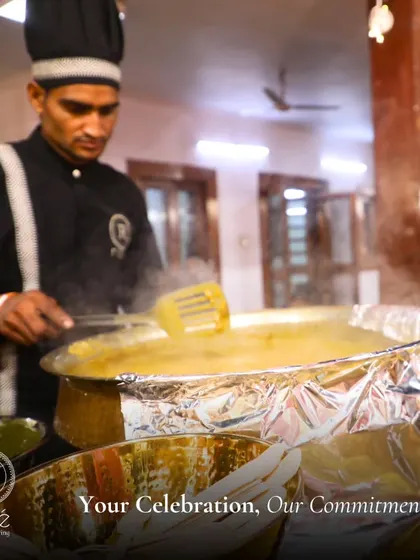 A chef at a live cooking station, fully focused on preparing a dish. Our team's commitment to culinary excellence is evident in every action, ensuring a high-quality experience for your guests.