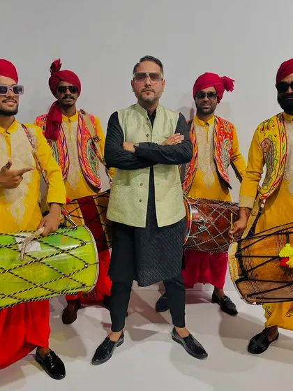Bringing the dhol and desi beats for a full-power Dandiya night. I love creating authentic experiences, and posing with these talented dhol players was a highlight.