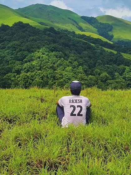 Finding a moment of solitude amidst the vast green meadows of the Bandaje trail.