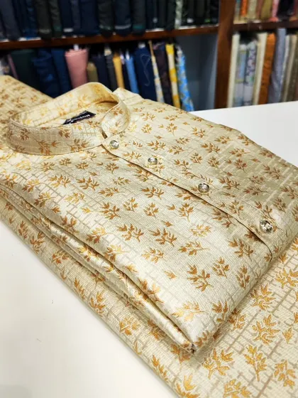 A classic beige kurta with a gold foil print, a subtle and elegant option for any festive occasion.